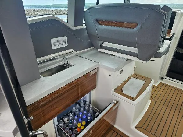 Slide: The Image of 2021 Tiara Sport 43 LE yacht interior with beverage drawer and sink. - 21