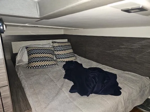 Slide: The Image of 2021 Tiara Sport 43 LE cabin bed with pillows and blanket. - 26