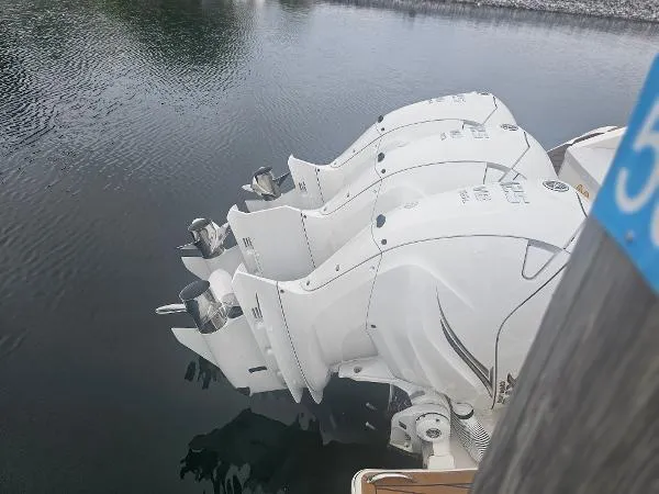 Slide: The Image of 2021 Tiara Sport 43 LE with triple outboard engines docked. - 31