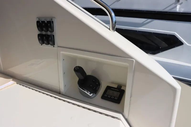 Slide: The Image of Control panel of a 2014 Marquis 42 Sport Bridge yacht with joystick and display. - 15