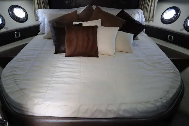 Slide: The Image of Luxurious bed with pillows in 2014 Marquis 42 Sport Bridge yacht cabin. - 35