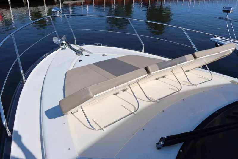 Slide: The Image of 2014 Marquis 42 Sport Bridge bow with sun loungers and stainless steel railings. - 41