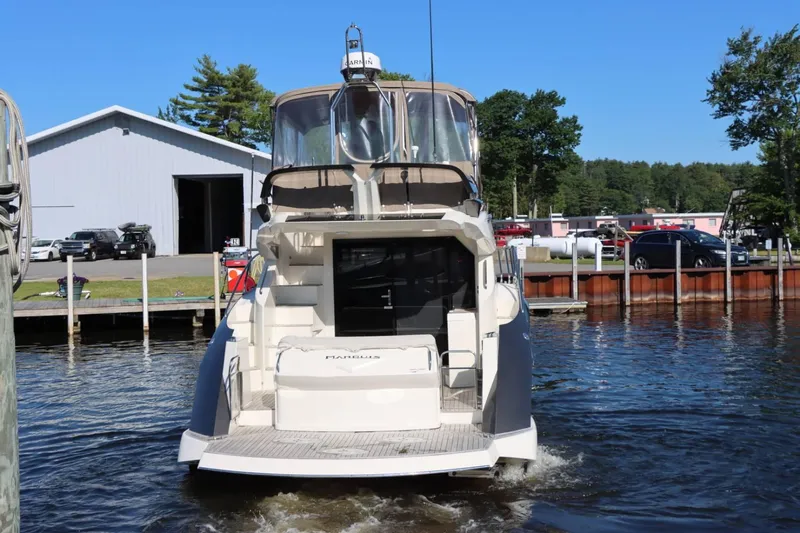 Slide: The Image of 2014 Marquis 42 Sport Bridge yacht docked at marina. - 6