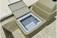 Slide: The Image of 2024 Tracker Grizzly 1754 SC boat storage compartment with open lid. - 9