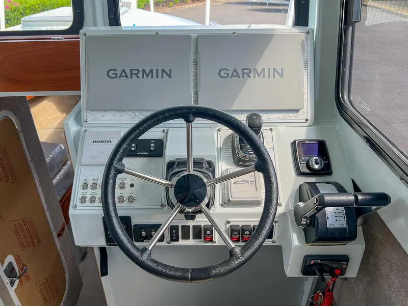 Slide: The Image of Helm of 2022 Hewescraft 290 Adventure with Garmin navigation system. - 11