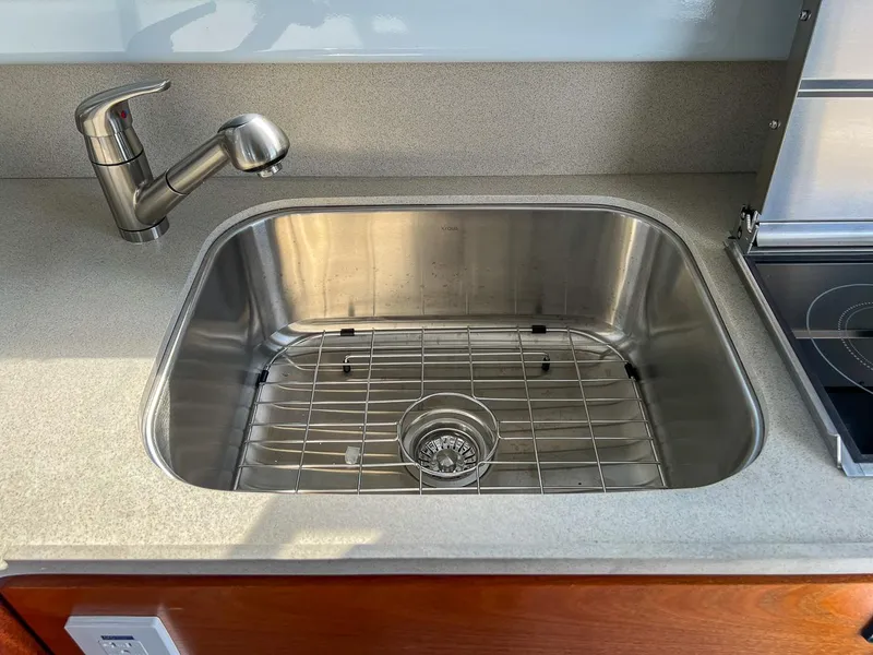 Slide: The Image of Stainless steel sink and faucet in 2022 Hewescraft 290 Adventure boat kitchen. - 17