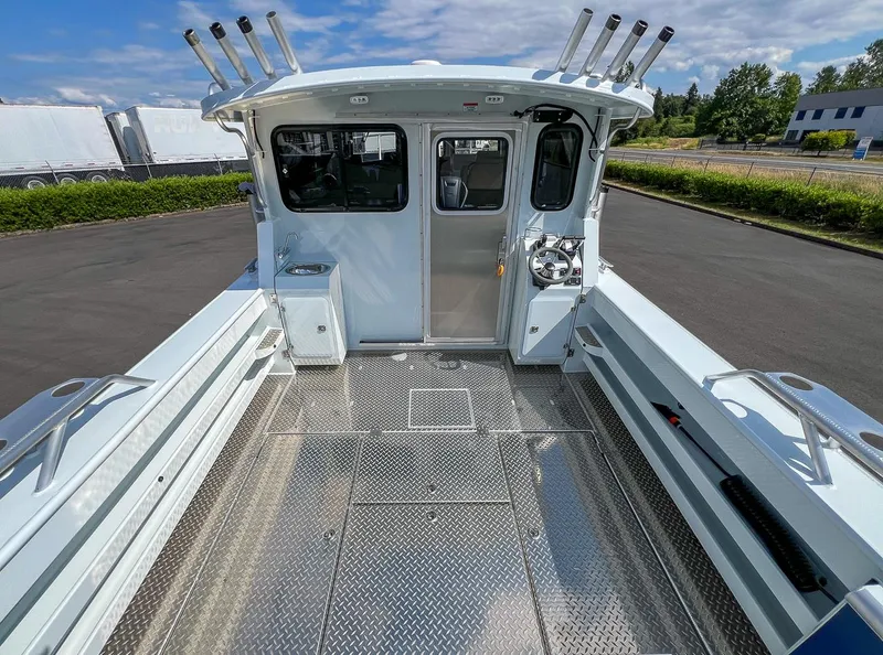 Slide: The Image of 2022 Hewescraft 290 Adventure boat deck with fishing rod holders and storage compartments. - 25
