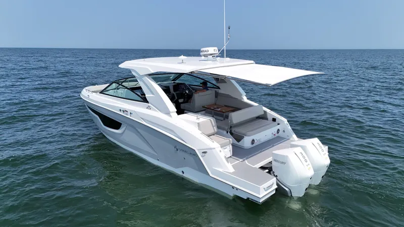 The Image of 2025 Cruisers Yachts 34 GLS Outboard on open water, showcasing sleek design and luxury features. - 0