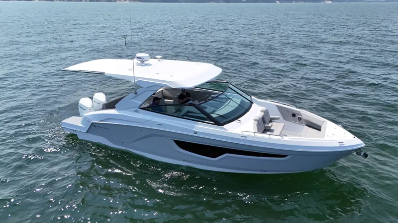 Slide: The Image of 2025 Cruisers Yachts 34 GLS Outboard on open water, sleek design, modern features. - 3