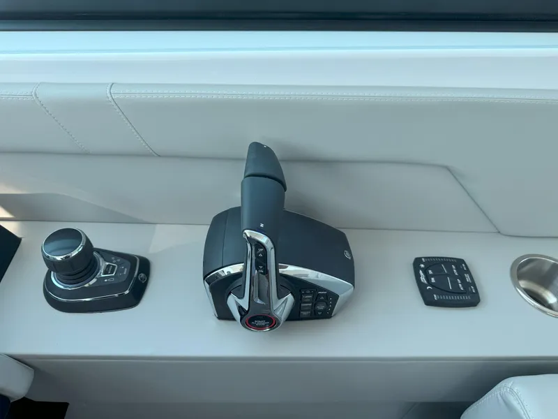Slide: The Image of 2025 Cruisers Yachts 34 GLS Outboard control panel with joystick and throttle. - 32
