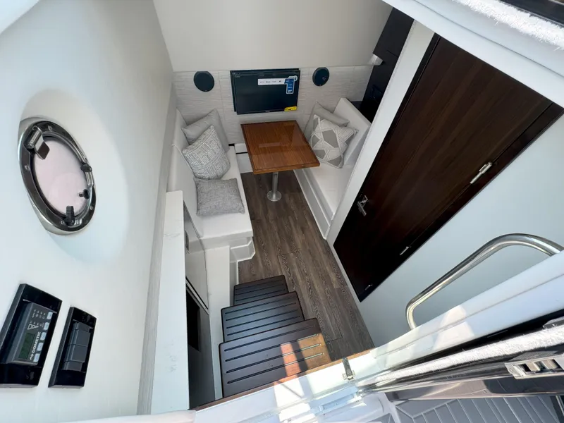 Slide: The Image of Luxurious interior of 2025 Cruisers Yachts 34 GLS Outboard with modern seating and table. - 37