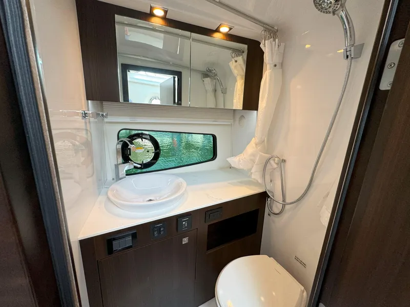 Slide: The Image of Luxurious bathroom in 2025 Cruisers Yachts 34 GLS Outboard with modern fixtures. - 46