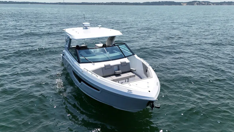 Slide: The Image of 2025 Cruisers Yachts 34 GLS Outboard on open water, showcasing sleek design and luxury features. - 9