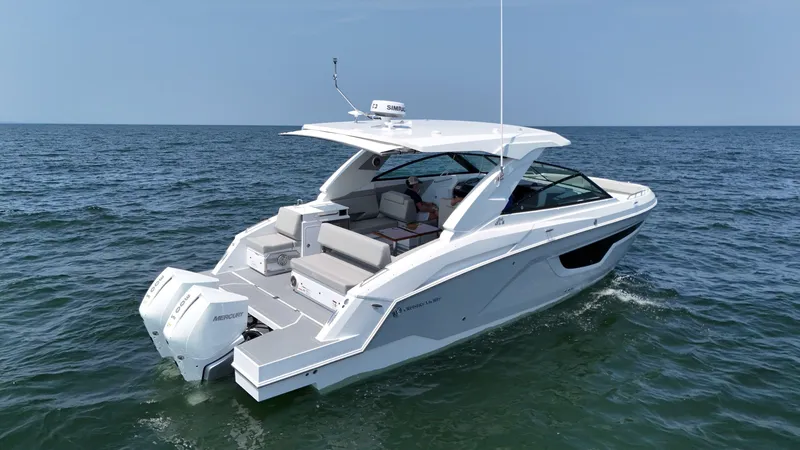 Slide: The Image of 2025 Cruisers Yachts 34 GLS Outboard on open water, showcasing sleek design and powerful engines. - 13