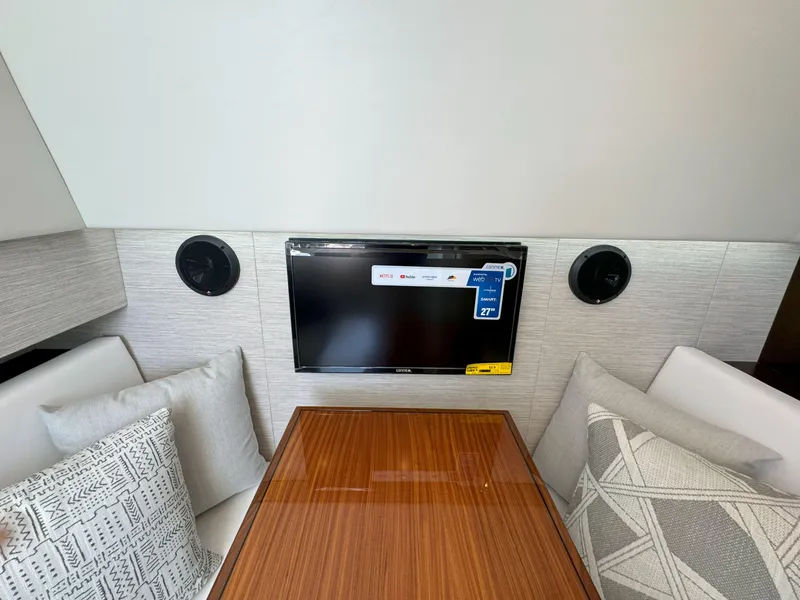 Slide: The Image of Interior of 2025 Cruisers Yachts 34 GLS Outboard with TV and cushions. - 45