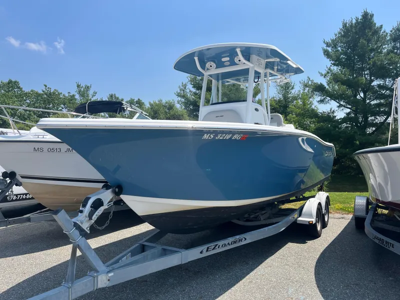 Slide: The Image of 2019 Sea Pro 239 Center Console boat on trailer, parked outdoors. - 1
