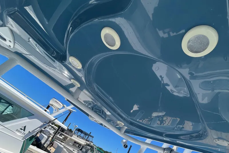 Slide: The Image of 2019 Sea Pro 239 Center Console boat with blue interior and docked at marina. - 15