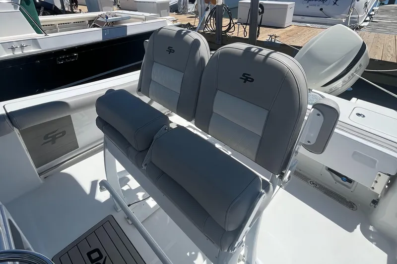 Slide: The Image of 2019 Sea Pro 239 Center Console boat seating area with cushioned seats. - 17