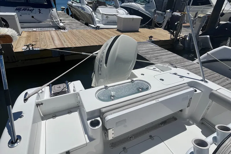 Slide: The Image of 2019 Sea Pro 239 Center Console boat docked at a marina. - 19