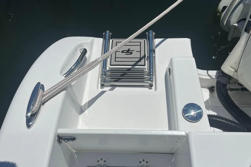 Slide: The Image of 2019 Sea Pro 239 Center Console boat with folded ladder and rope cleat. - 20