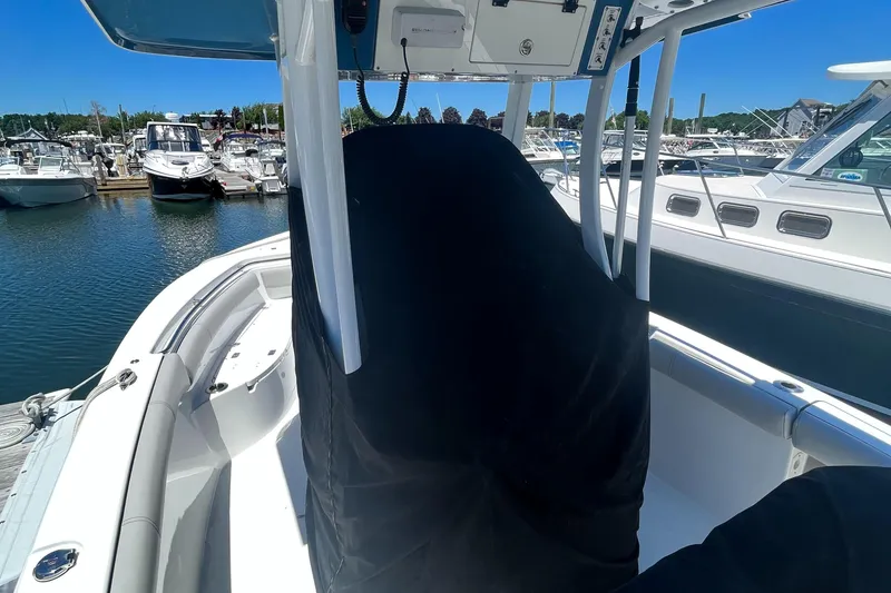 Slide: The Image of 2019 Sea Pro 239 Center Console boat docked at a marina. - 27