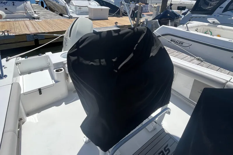 Slide: The Image of 2019 Sea Pro 239 Center Console boat at dock with covered console. - 29