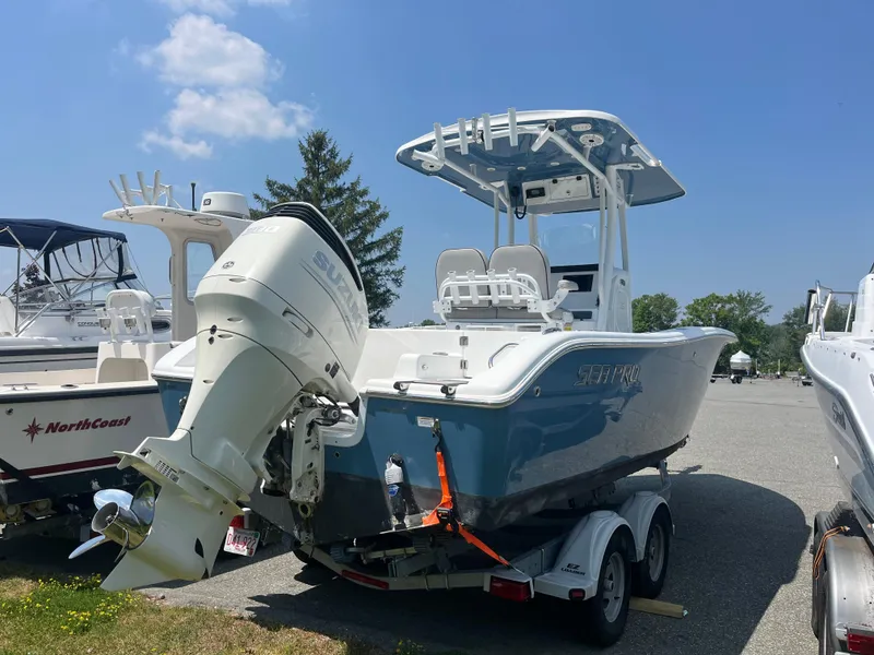 Slide: The Image of 2019 Sea Pro 239 Center Console boat on trailer, featuring Suzuki outboard motor. - 3