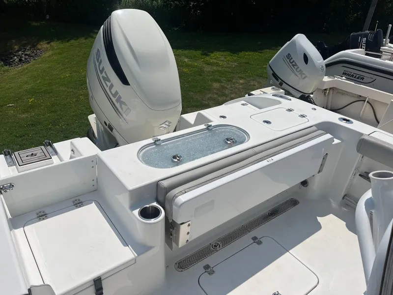 Slide: The Image of 2019 Sea Pro 239 Center Console boat with Suzuki outboard motor, featuring a spacious deck. - 37