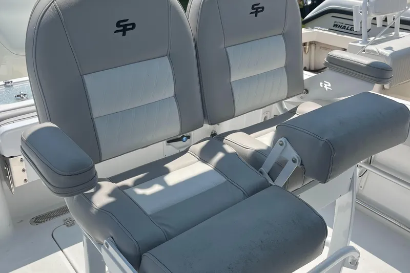 Slide: The Image of 2019 Sea Pro 239 Center Console boat seats with gray upholstery and armrests. - 39