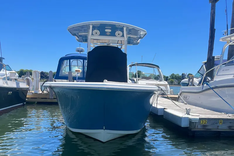 Slide: The Image of 2019 Sea Pro 239 Center Console boat docked at a marina. - 7