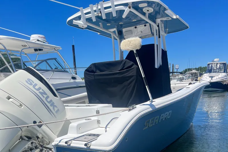 Slide: The Image of 2019 Sea Pro 239 Center Console boat docked with Suzuki outboard motor. - 8