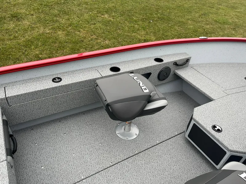 Slide: The Image of 2025 Lund 1675 Adventure SS boat interior with seating and storage. - 13