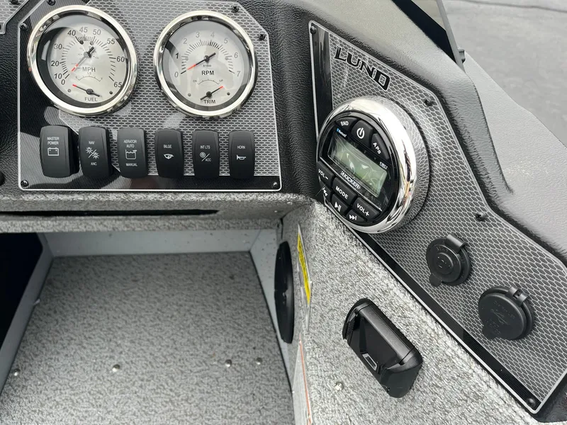 Slide: The Image of Dashboard of 2025 Lund 1675 Adventure SS boat with gauges and controls. - 7