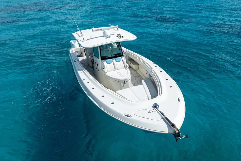 Slide: The Image of 2018 Hydra-Sports 4200 Siesta boat on clear blue water. - 10