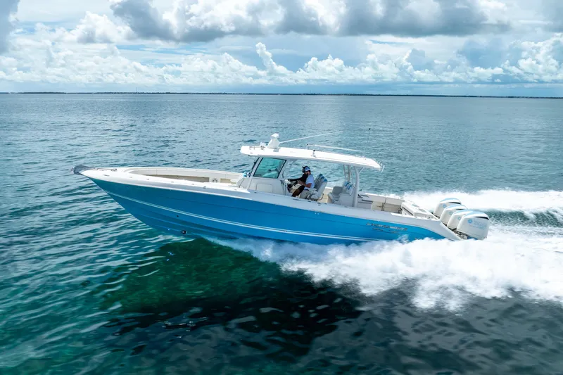 Slide: The Image of 2018 Hydra-Sports 4200 Siesta boat cruising on open water under cloudy sky. - 12