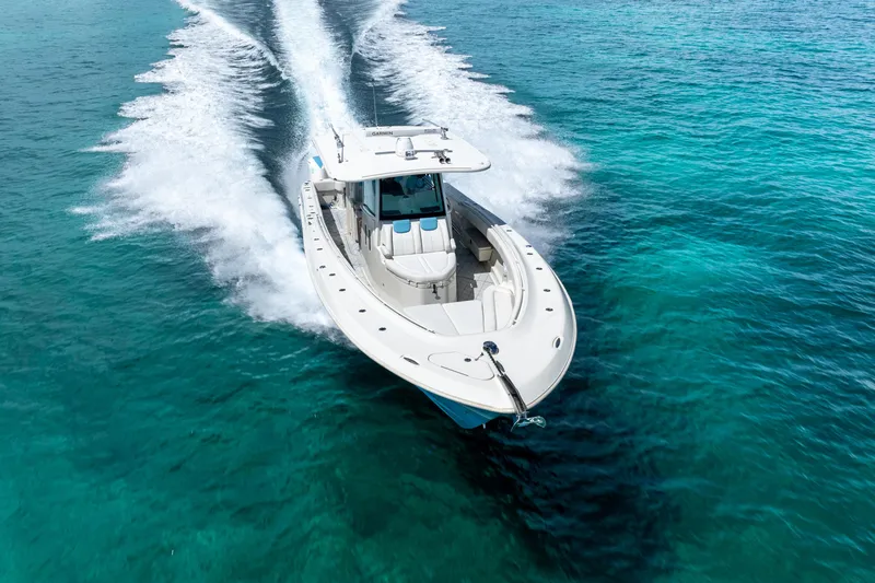 Slide: The Image of 2018 Hydra-Sports 4200 Siesta cruising on clear blue water. - 15