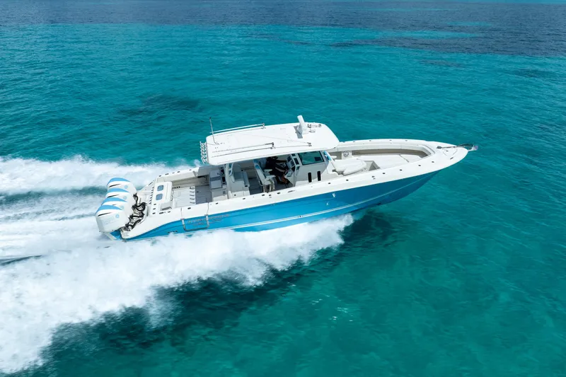 Slide: The Image of 2018 Hydra-Sports 4200 Siesta boat cruising on clear blue water. - 18