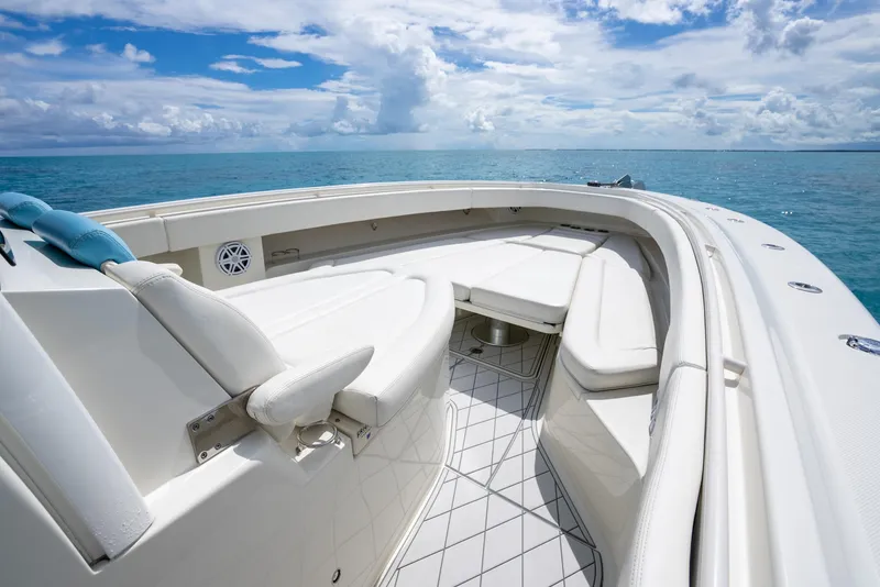 Slide: The Image of 2018 Hydra-Sports 4200 Siesta boat interior with white seating and ocean view. - 23