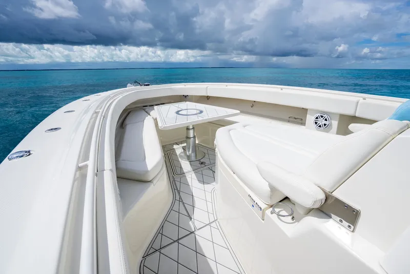 Slide: The Image of 2018 Hydra-Sports 4200 Siesta boat interior with white seating and ocean view. - 24
