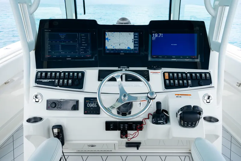 Slide: The Image of 2018 Hydra-Sports 4200 Siesta boat dashboard with advanced navigation and control systems. - 29