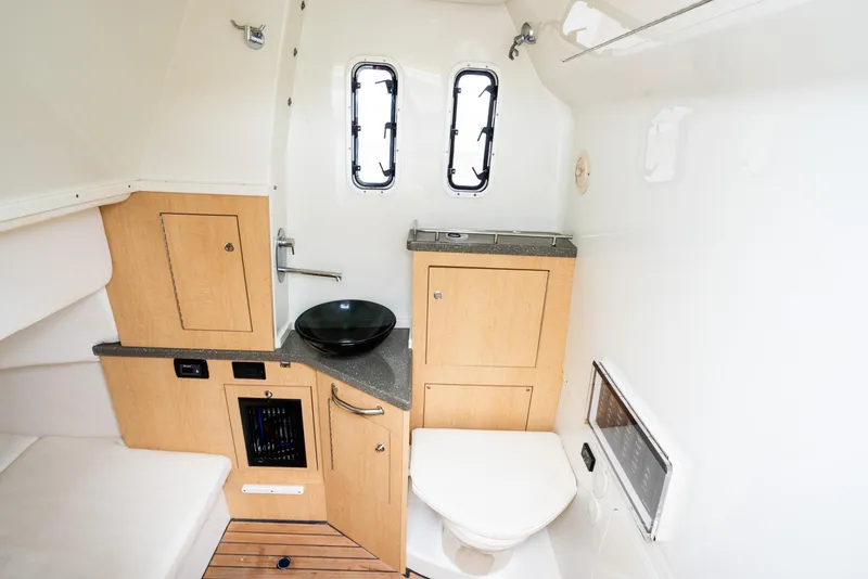 Slide: The Image of 2018 Hydra-Sports 4200 Siesta boat cabin with sink, toilet, and storage. - 38