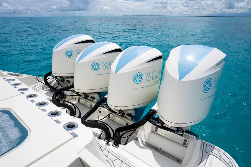 Slide: The Image of 2018 Hydra-Sports 4200 Siesta boat with four Yamaha outboard engines on turquoise water. - 48