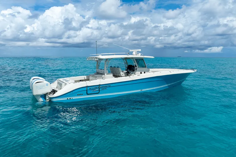 Slide: The Image of 2018 Hydra-Sports 4200 Siesta boat on clear blue ocean water under a partly cloudy sky. - 5