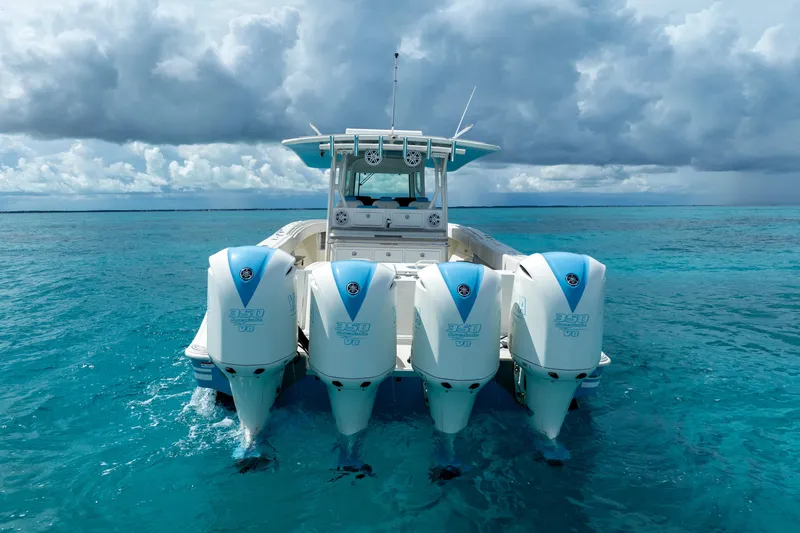 Slide: The Image of 2018 Hydra-Sports 4200 Siesta boat with quad engines on turquoise water. - 9