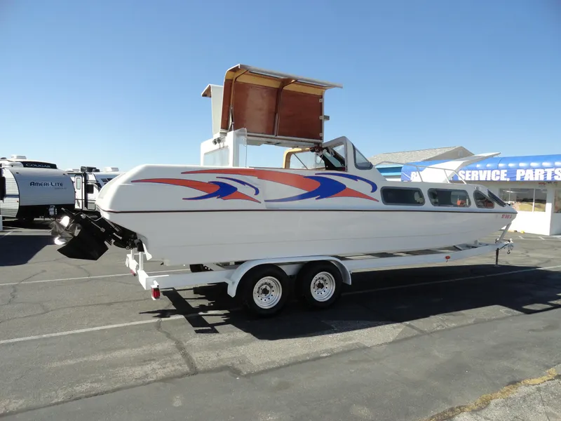 Slide: The Image of 1996 Hallett Party Cruiser Gull Wing 300 boat on trailer, side view. - 10