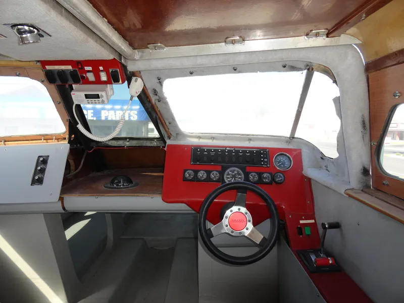 Slide: The Image of Interior cockpit of a 1996 Hallett Party Cruiser Gull Wing 300 boat. - 13