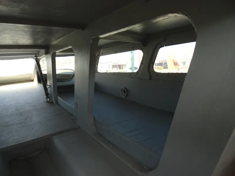Slide: The Image of Interior of 1996 Hallett Party Cruiser Gull Wing 300 with seating and windows. - 18
