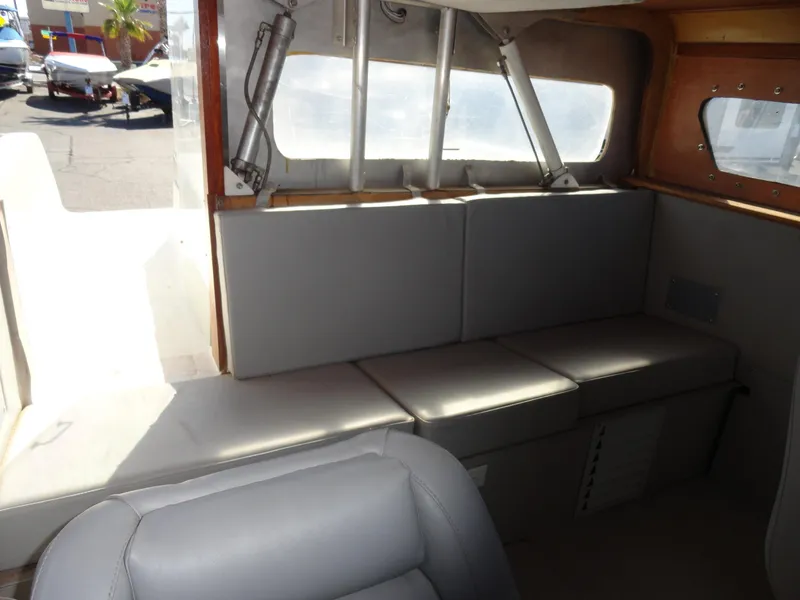 Slide: The Image of Interior seating of 1996 Hallett Party Cruiser Gull Wing 300 boat with grey cushions. - 20