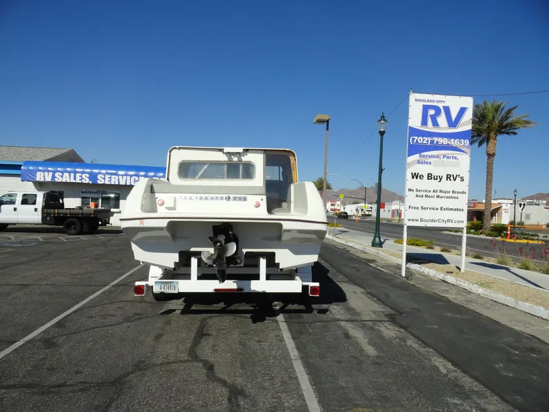 Slide: The Image of 1996 Hallett Party Cruiser Gull Wing 300 boat on trailer at RV sales lot. - 26