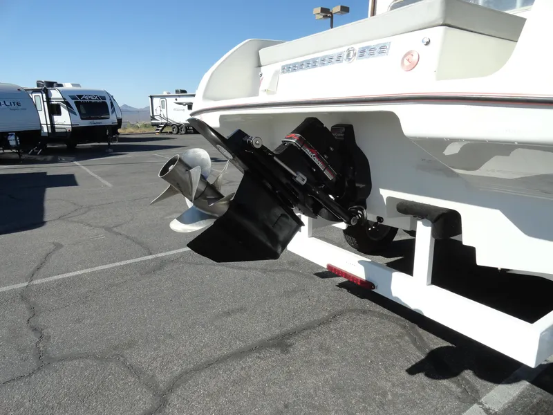 Slide: The Image of 1996 Hallett Party Cruiser Gull Wing 300 boat on trailer, showing propeller and outdrive. - 28